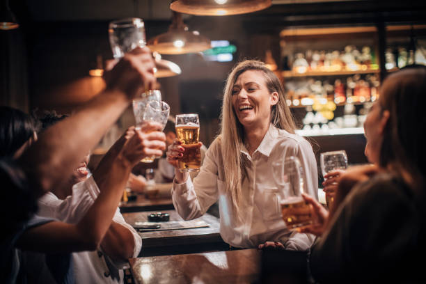 Friends having fun drinking beer in a bar