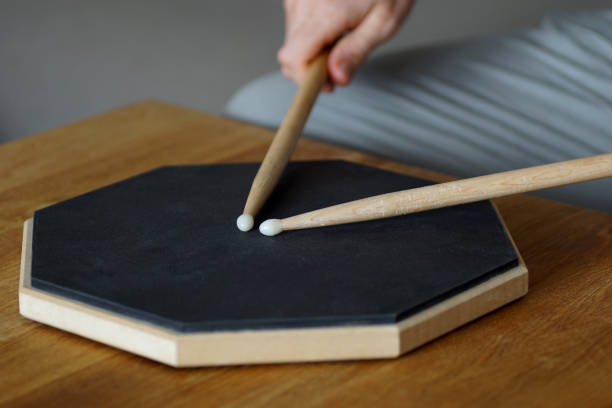 istock Close up of drumming on a practice pad at home 1202342237