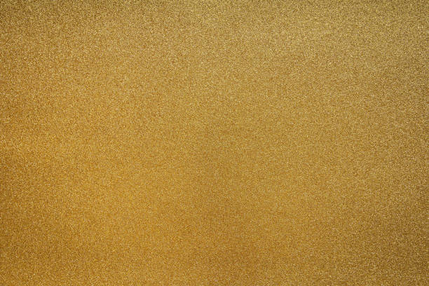 istock Fine Detailed texture of glittering golden dust surface 1202343528