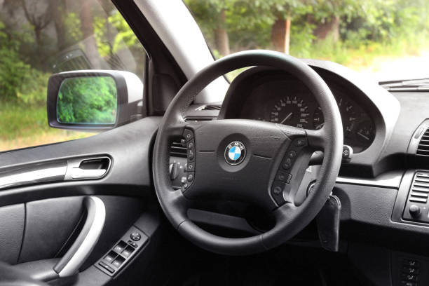The salon of a BMW car. Black skin. View of the interior of a modern automobile showing the dashboard stock photo
