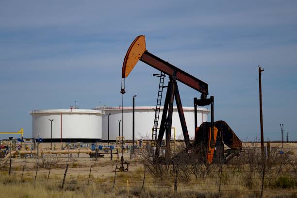 istock Pumping unit and tank batteries in the Permian Basin 1202344214