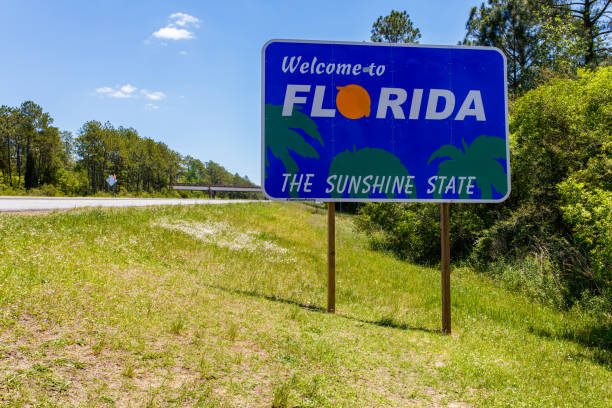 Florida state sign Welcome sign entering the state of Florida southbound from Georgia along Interstate 95. florida stock pictures, royalty-free photos & images