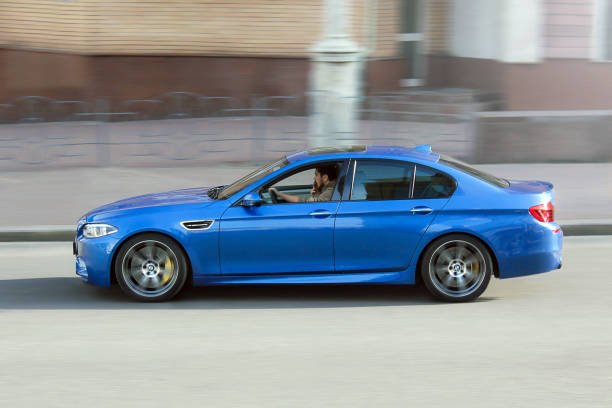BMW M5 (F10) in motion at high speed stock photo