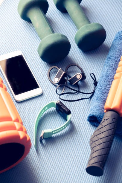 istock fitness equipment and electronics on a blue yoga mat 1202345109