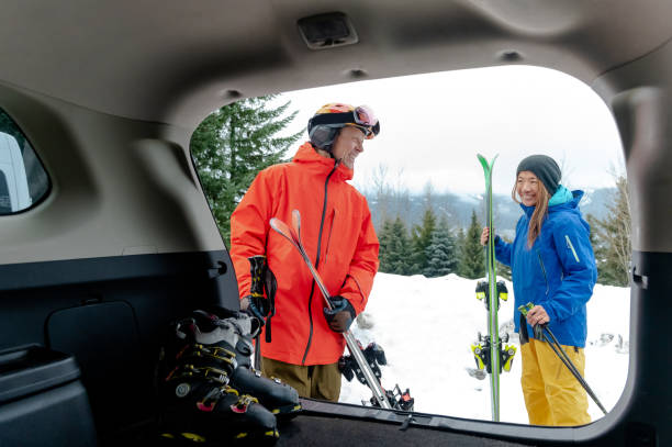 istock Couple getting ready for skiing from their car 1202345270