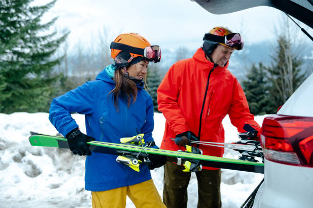 istock Couple getting ready for skiing from their car 1202345271