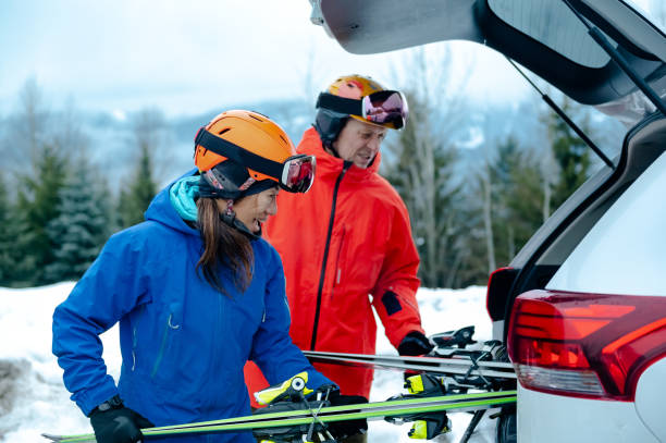 istock Couple getting ready for skiing from their car 1202345273