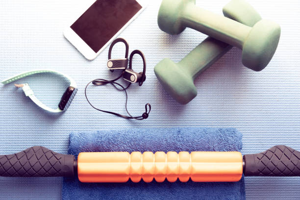istock fitness equipment and electronics on a blue yoga mat 1202345557