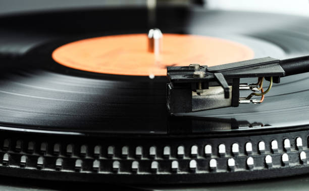 istock Black vinyl record. The needle on a vinyl record. 1202345608