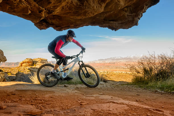 istock Mountain Biker Riding Through Boulders in The Southwest Desert 1202346684