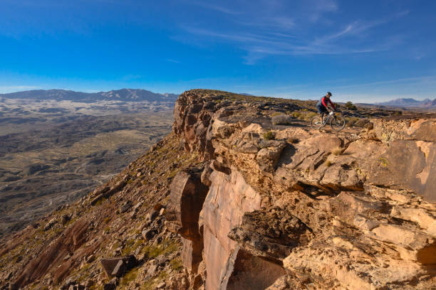 istock Mountain Biker Riding The Southwest Desert On A Bluff 1202347126
