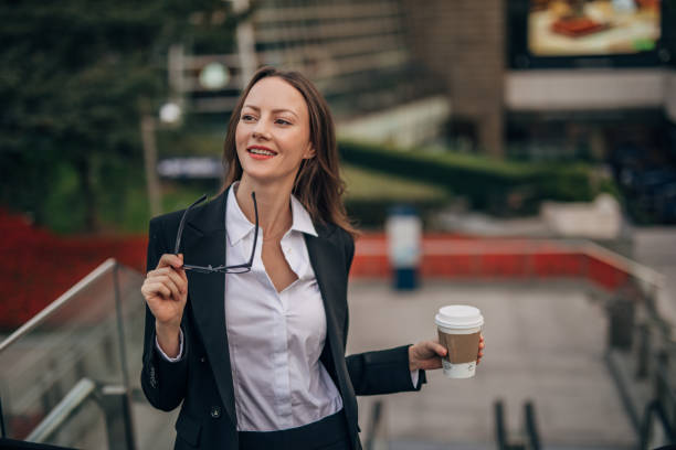 istock Young woman with coffee cup 1202347364