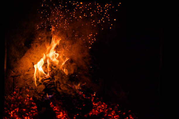 istock A glowing fire in the stone fireplace 1202347425