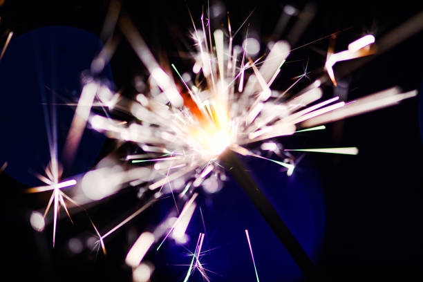 istock Sparks in the dark. Sparks. Christmas and New Year time. Magic light 1202348065