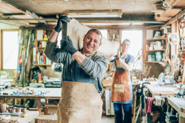istock Carpenters carrying a wood plank 1202349864