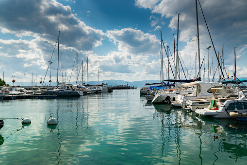 Thonon les Bains,France-August 02,2019: Boats in the port of Thonon les Bains on Lake Geneva.Thonon les Bains was the historic capital of Chablais, a province of the old Duchy of Savoy in France.