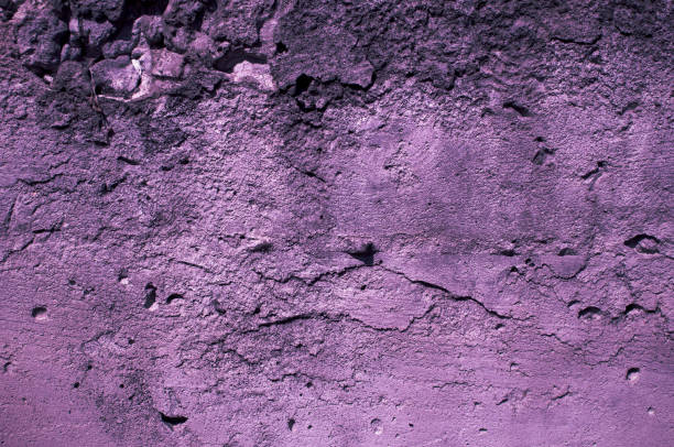 istock Concrete texture wall with trendy neon glow. Background with violet neon 1202354794
