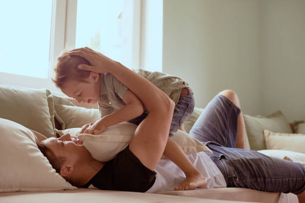 istock A Father and son in bed, happy time on bed 1202354949