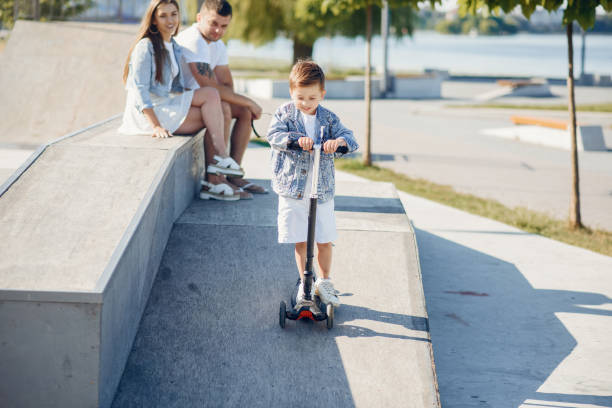 istock Cute family playing in a summer park 1202357060