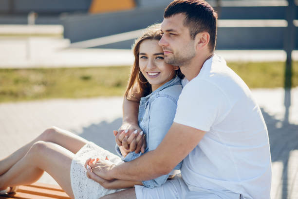 istock Beautiful couple spend time on a summer park 1202357172
