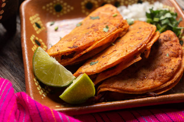 istock Mexican beef barbacoa tacos on wooden background 1202357187