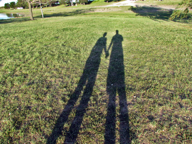 istock A couple walking in the sunset 1202358531