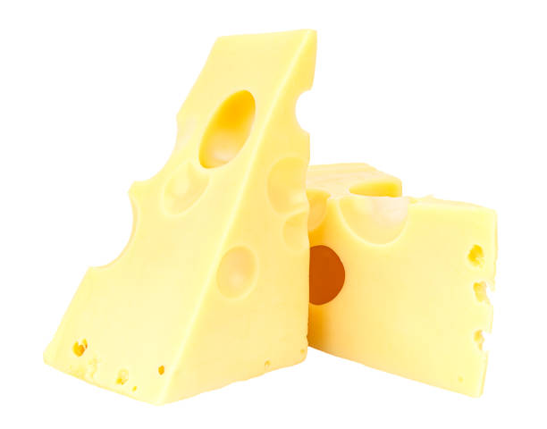 istock Standing and lying two triangular pieces of Maasdam cheese isolated on a white background 1202358890