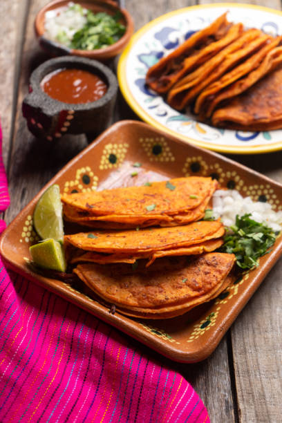 istock Mexican beef barbacoa tacos on wooden background 1202359314