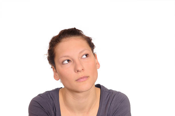 istock young woman looks pensively 120236494