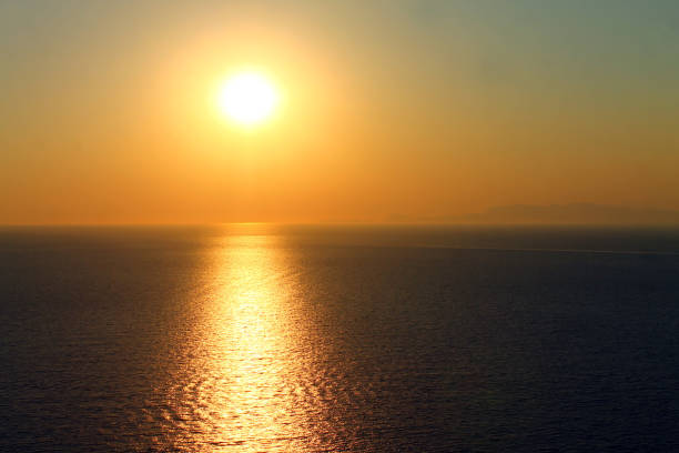 istock A powerful yellow sunset on the sea in Greece 1202366031