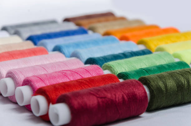 istock sewing threads different colors, very colorful in background, colorful background 1202366810