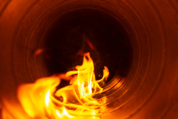 istock smoke and fire inside the air duct in the ventilation system, the front and back background is blurred with a bokeh effect 1202367401