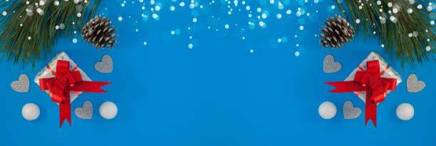 istock Christmas background with beautiful gift or present box, snowy pine cones and decorative snowballs, holiday. Top view 1202367460