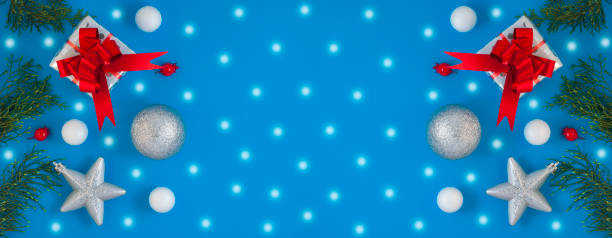 istock Christmas background with beautiful gift or present box, stars and decorative snowballs, holiday. Top view 1202368626