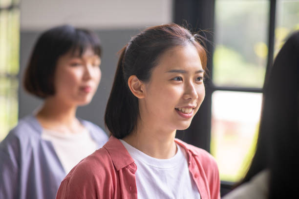 istock Young women standing in school corridor 1202368787
