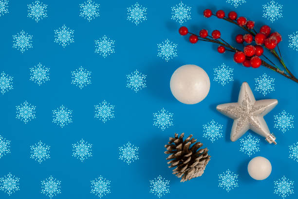 istock New Year holiday background. greeting card. Ornaments on blue background 1202368799