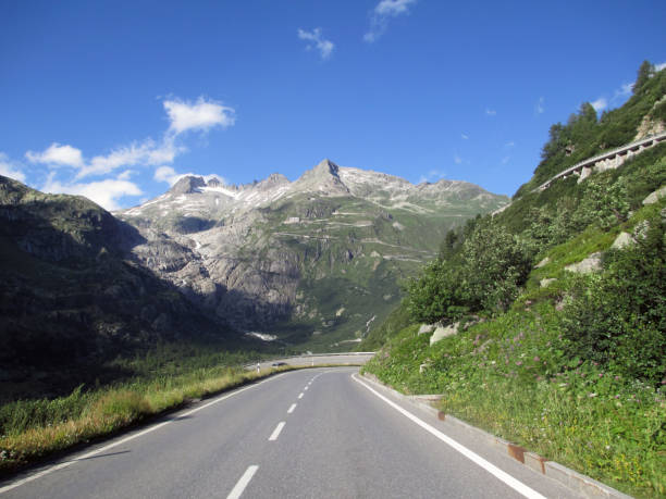 istock The road and the high switchbacks in Switzerland 1202373702