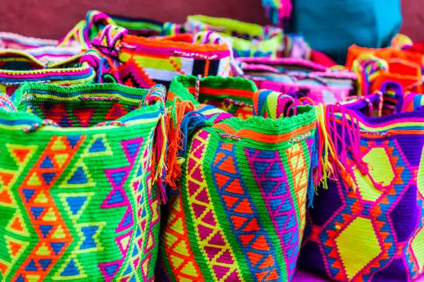 Street selling in Cartagena de Indias of traditional bags hand knitted by women of the Wayuu community in Colombia called mochilas