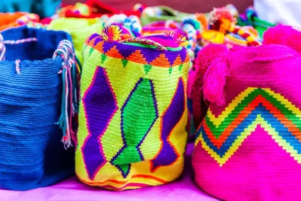 Street selling in Cartagena de Indias of traditional bags hand knitted by women of the Wayuu community in Colombia called mochilas