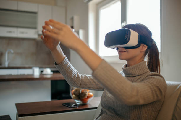 istock Pregnant woman having fun with virtual reality 1202378933