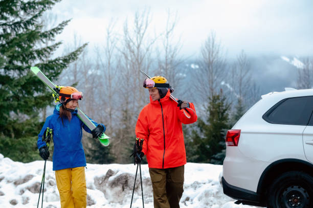 istock Couple arriving at a ski resort with their vehicle 1202379999