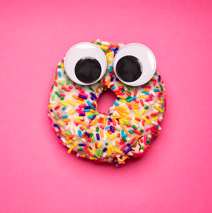 Donuts with funny faces and googly eyes