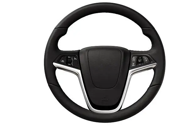 Close up image of modern steering wheel.