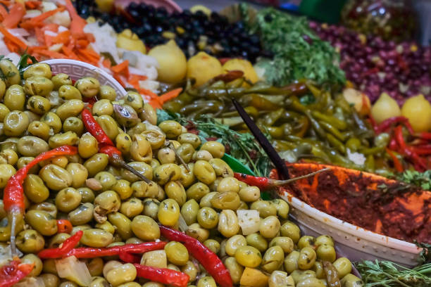 istock Green pickled olives at Fez souk market 1202383156