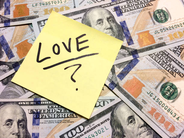 American cash money and yellow post it note with text Love with question mark American cash money and yellow post it note with text Love with question mark in black color aerial view philadelphia federal reserve stock pictures, royalty-free photos & images