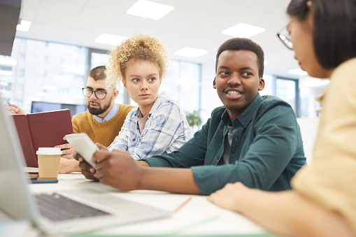 Working In College Group Of Students Working In College Library Stock Photo - Download ...