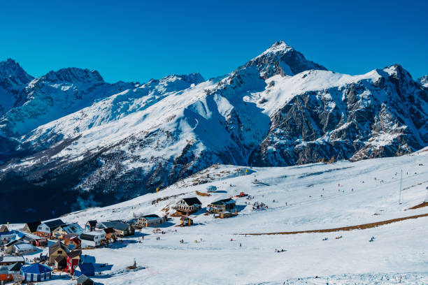 istock Downhill skiing resort in high mountains. Ski slope and ropeway lift 1202385591