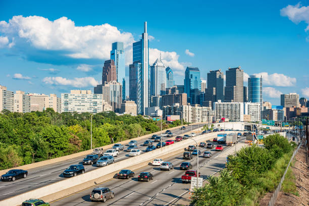 Stock photograph of downtown Philadelphia Pennsylvania USA with traffic on interstate I-76 on a sunny day.