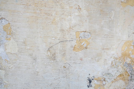 Full frame shot of weathered white ivory wall textured background