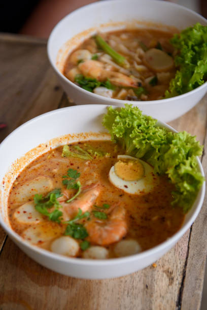 istock Authentic Thai Tomyum soup noodles with seafood and egg 1202400827